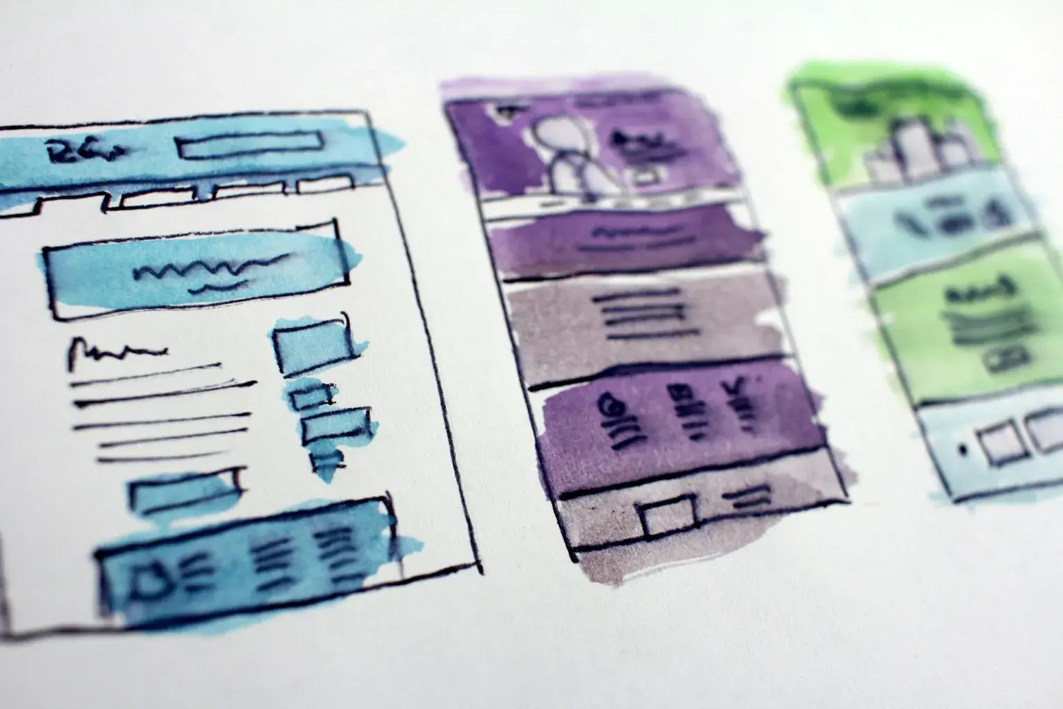 Watercolour sketches of website page layouts